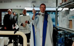 Bishop Burbidge blesses the new pantry in Alexandria