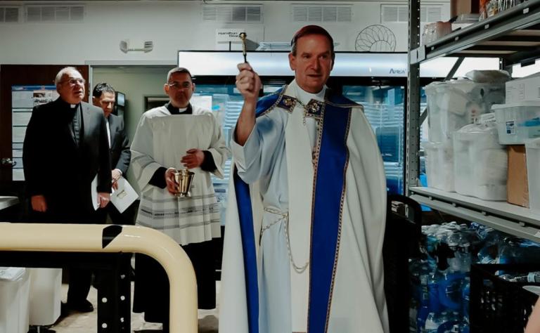 Bishop Burbidge blesses the new pantry in Alexandria